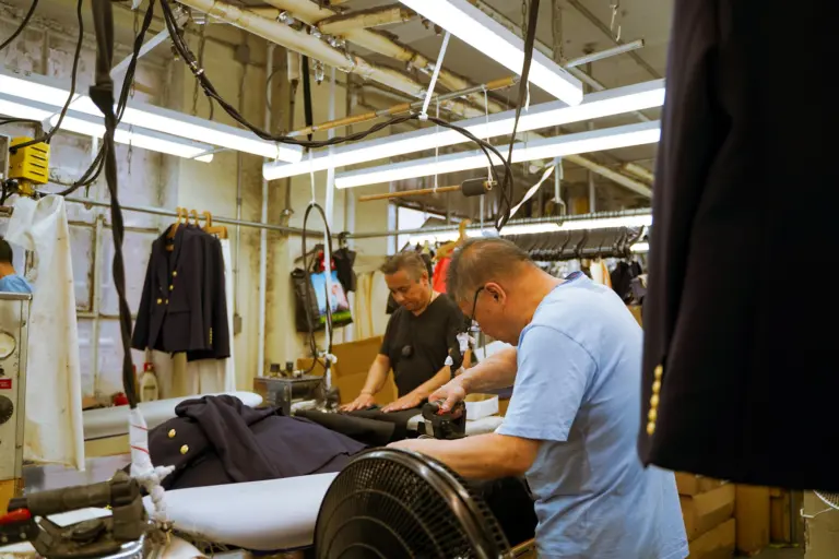 Workers operating machines in a garment factory