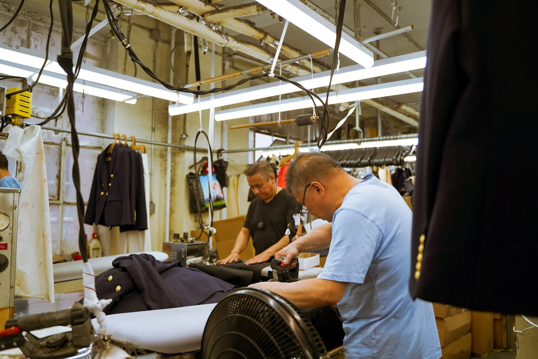 Workers operating machines in a garment factory